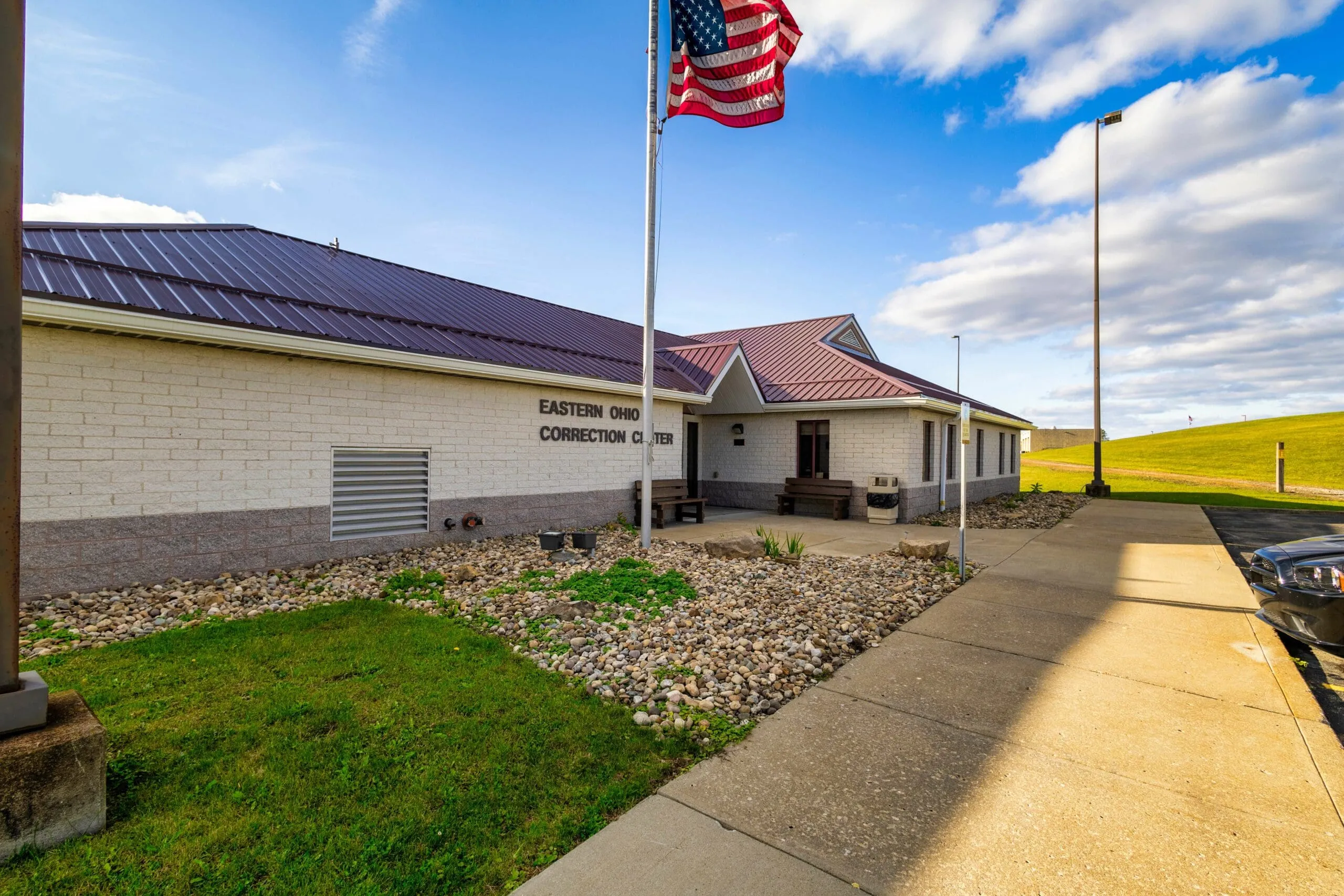 The Eastern Ohio Correction Center entrance beneath an American flag