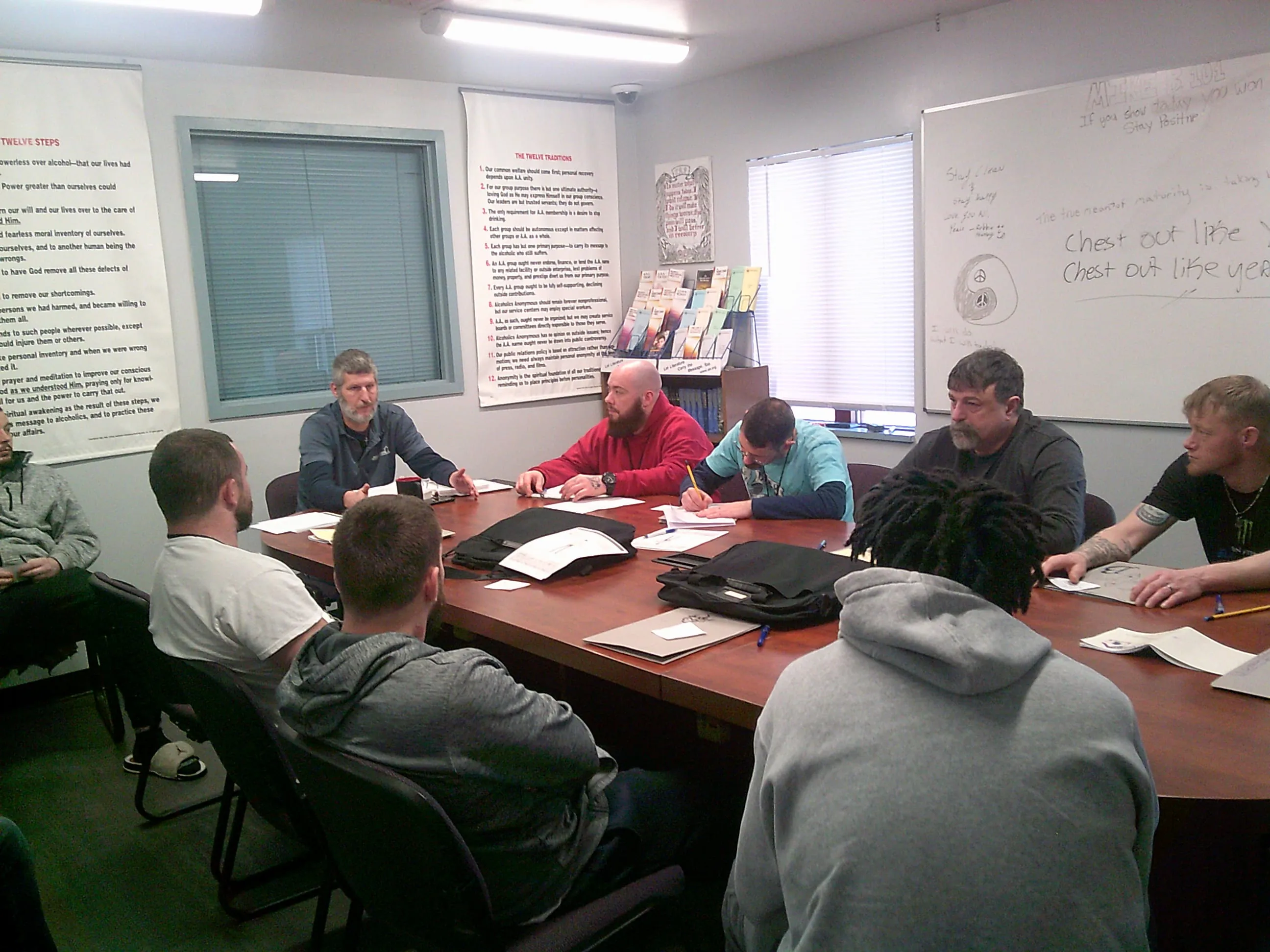 Residents taking part in a group session around a conference table